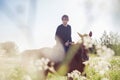 Young man riding a horse in the field Royalty Free Stock Photo