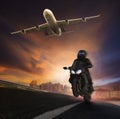 Young man riding motorcycle on asphalt highways road with high s Royalty Free Stock Photo