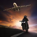 Young man riding motorcycle on asphalt highways road with high s Royalty Free Stock Photo