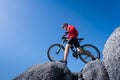 Young man riding mountain bike on the background of mountains Royalty Free Stock Photo