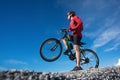 Male riding a mountain bike outdoor at blue sky Royalty Free Stock Photo