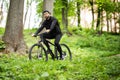 Young man riding mountain bike in forest Royalty Free Stock Photo