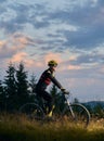 Young man riding a mountain bike on sunset Royalty Free Stock Photo