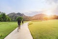 Young man riding retro bicycle in public park Royalty Free Stock Photo