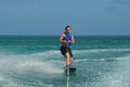 Young Man Riding a Wakeboard off the Coast of Aruba Royalty Free Stock Photo