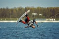 Young man riding wakeboard on a summer lake Royalty Free Stock Photo