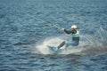 Young man riding wakeboard on a summer lake Royalty Free Stock Photo