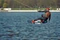 Young man riding wakeboard on a summer lake Royalty Free Stock Photo