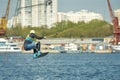 Young man riding wakeboard on a summer lake Royalty Free Stock Photo