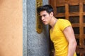 Young man ringing doorbell and talking on speaker Royalty Free Stock Photo