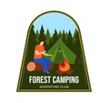 Young man roasting marshmallows at campfire in forest. Casual camper with tent and fire in nature badge design. Outdoor