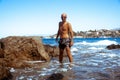 Young guy on the Rocky seashore Royalty Free Stock Photo