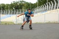 young man roller skating outdoors. Recreational activity Royalty Free Stock Photo