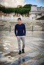 Young man in Rome in front of Vittoriano monument Royalty Free Stock Photo