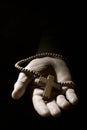 Young man with a rosary in his hand Royalty Free Stock Photo