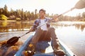 Young Man Rowing Kayak On Lake Royalty Free Stock Photo