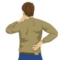 Young man rubbing his painful back. Pain relief, chiropractic concept Royalty Free Stock Photo