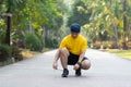 Young man runner tying shoelaces. Royalty Free Stock Photo