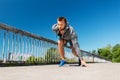 Young man running across city bridge Royalty Free Stock Photo