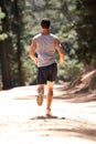 Young man running along country lane Royalty Free Stock Photo