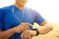 Man running on beach and checking Heart Rate Monitor On watch Royalty Free Stock Photo