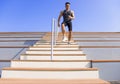 young man running downstairs at stadium Royalty Free Stock Photo