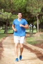 Young man running in park Royalty Free Stock Photo