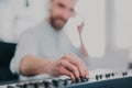 Young man`s hands playing keyboard piano, composing music , music record concep, art, song composition, dj performance