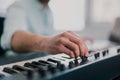 Young man`s hands playing keyboard piano, composing music , music record concep, art, song composition, dj