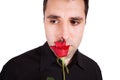 Young man sad with red rose Royalty Free Stock Photo