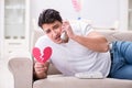 The young man in sad saint valentine concept Royalty Free Stock Photo