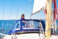 Young man sailing. Teenager boy on sea sail boat.