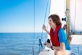 Young man sailing. Teenager boy on sea sail boat.