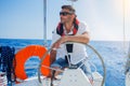 Young man sailing yacht Royalty Free Stock Photo