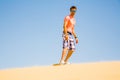 Young man sand boarding Royalty Free Stock Photo