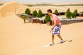 Young man sand boarding Royalty Free Stock Photo