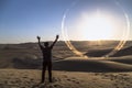 young man on sand in a desert near Huacachina, Ica region, Peru. The sunset desert view Royalty Free Stock Photo