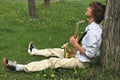 Young man with saxophone Royalty Free Stock Photo