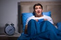 The young man scared in bed Royalty Free Stock Photo