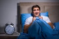 The young man scared in bed Royalty Free Stock Photo