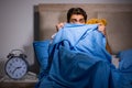 The young man scared in bed Royalty Free Stock Photo
