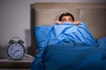 The young man scared in bed Royalty Free Stock Photo