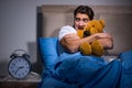 The young man scared in bed Royalty Free Stock Photo