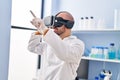 Young man scientist using virtual reality goggles at laboratory Royalty Free Stock Photo