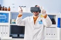 Young man scientist using virtual reality goggles at laboratory Royalty Free Stock Photo