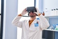 Young man scientist using virtual reality goggles at laboratory Royalty Free Stock Photo