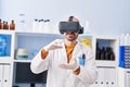 Young man scientist using virtual reality goggles at laboratory Royalty Free Stock Photo