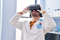 Young man scientist using virtual reality goggles at laboratory Royalty Free Stock Photo