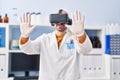 Young man scientist using virtual reality goggles at laboratory Royalty Free Stock Photo