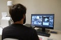 Young man scientist working with scanning electron microscope